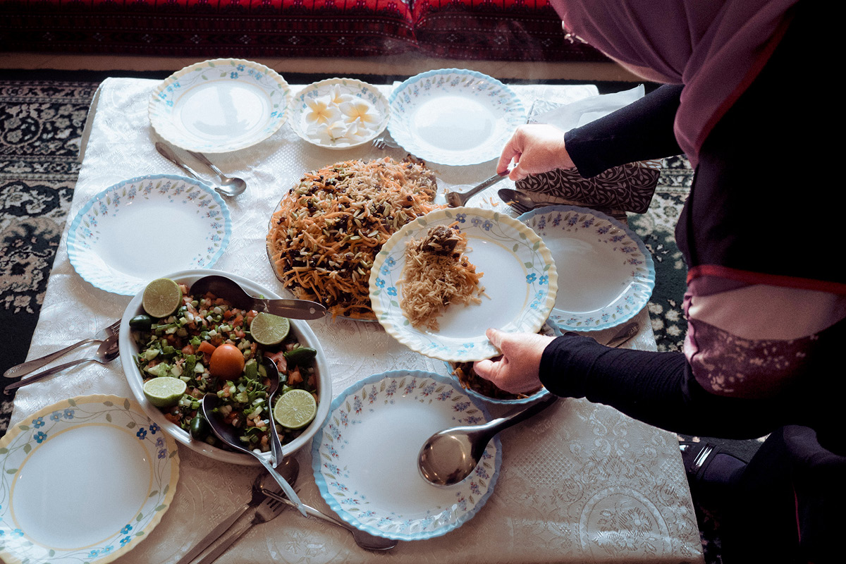 Afghani lady serving food